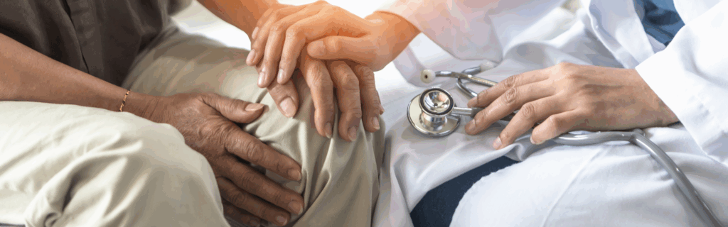 nurse holding patients hand